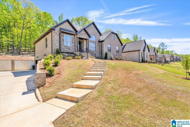 2092 Grey Oaks Ter, Pelham, AL 35124 - craftsman-style home featuring a front lawn, driveway, a residential view, and a garage