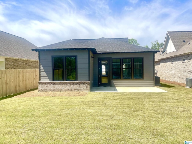 342 Shiloh Creek Dr, Calera, AL 35040 - back of property featuring a shingled roof, cooling unit, brick siding, and a patio