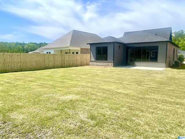 342 Shiloh Creek Dr, Calera, AL 35040 - back of property featuring central AC unit and brick siding