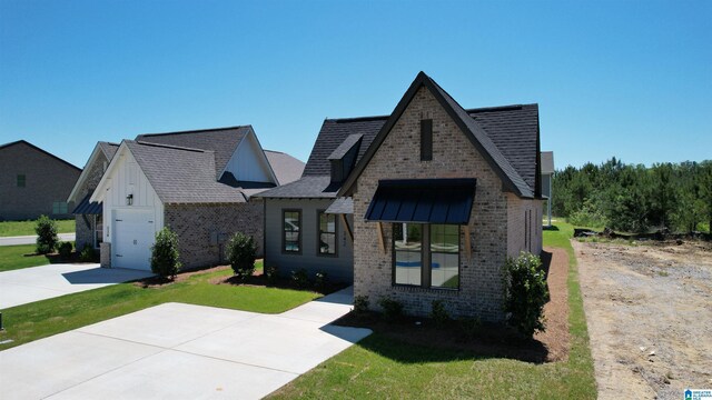 342 Shiloh Creek Dr, Calera, AL 35040 - view of front of property with brick siding, driveway, a front lawn, a shingled roof, and an attached garage