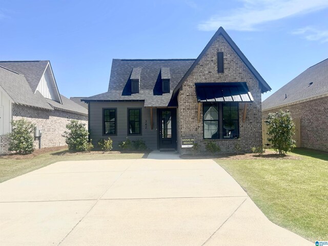 342 Shiloh Creek Dr, Calera, AL 35040 - view of front facade featuring a front lawn and brick siding