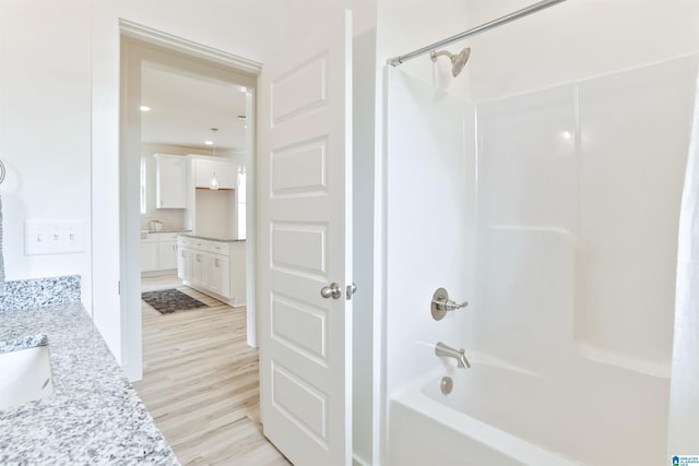 342 Shiloh Creek Dr, Calera, AL 35040 - bathroom featuring vanity, shower / bathtub combination, and wood finished floors