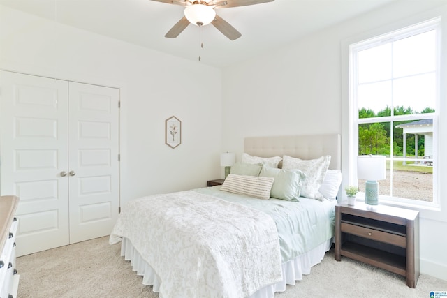 342 Shiloh Creek Dr, Calera, AL 35040 - bedroom with light carpet, a closet, and a ceiling fan