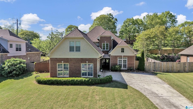 712 Valley St, Hoover, AL 35226 - craftsman inspired home with brick siding, fence, and a front yard