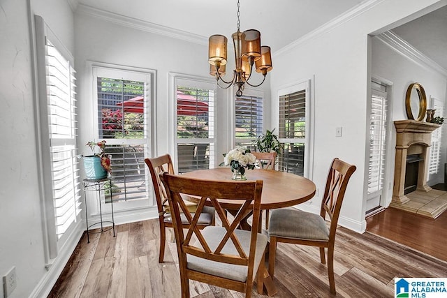 712 Valley St, Hoover, AL 35226 - dining area featuring a chandelier, wood finished floors, a wealth of natural light, and ornamental molding