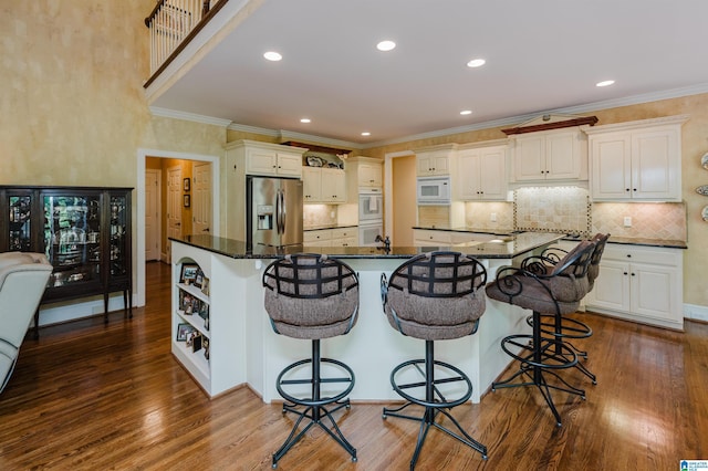 4527 High Court Cir, Hoover, AL 35242 - kitchen featuring dark wood-style flooring, open shelves, white appliances, and a breakfast bar area