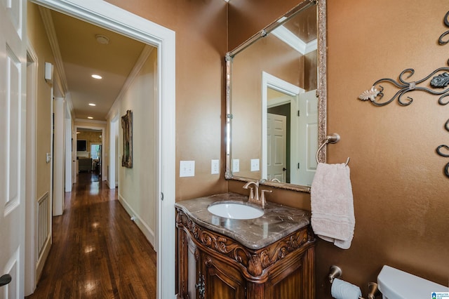4527 High Court Cir, Hoover, AL 35242 - half bathroom featuring wood finished floors, vanity, toilet, ornamental molding, and visible vents