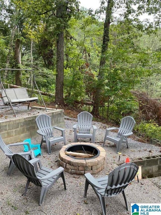 view of patio / terrace with a fire pit