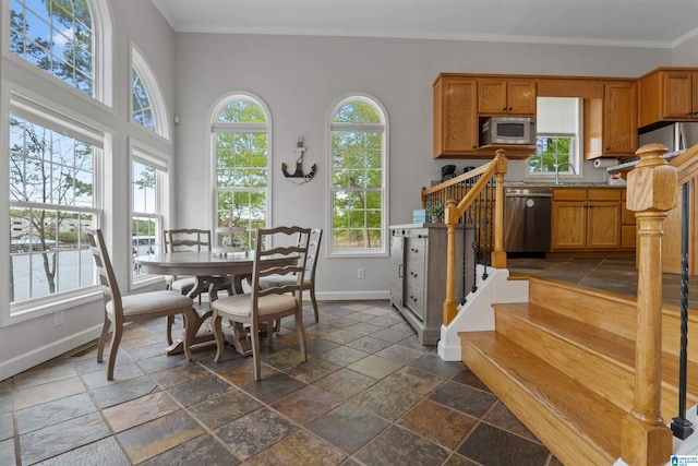 387 Misty Ln, Wedowee, AL 36278 - dining space with baseboards, crown molding, stone tile floors, and stairs