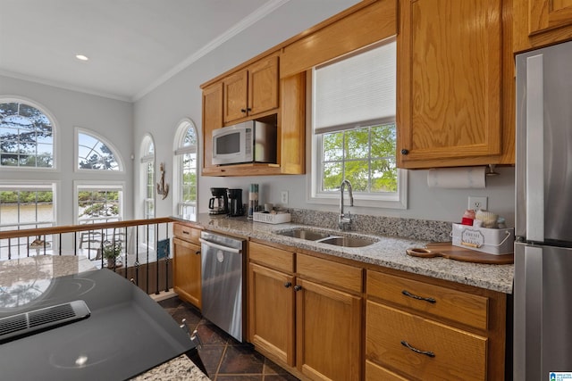 387 Misty Ln, Wedowee, AL 36278 - kitchen featuring light stone counters, a sink, crown molding, brown cabinetry, and appliances with stainless steel finishes