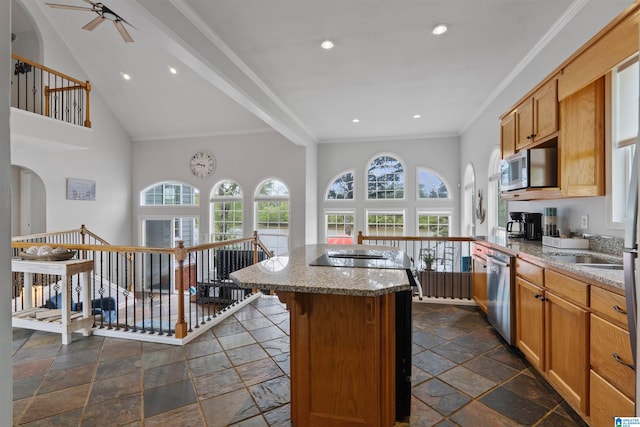 387 Misty Ln, Wedowee, AL 36278 - kitchen with light stone counters, stone tile flooring, a center island, appliances with stainless steel finishes, and ceiling fan
