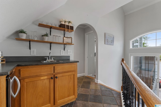 387 Misty Ln, Wedowee, AL 36278 - bar featuring stone tile floors, a sink, arched walkways, baseboards, and indoor wet bar