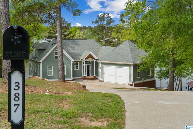 387 Misty Ln, Wedowee, AL 36278 - single story home with an attached garage, a shingled roof, and driveway