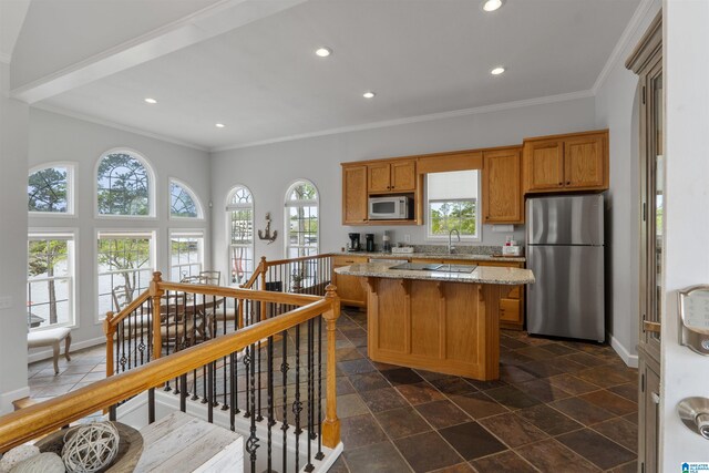 387 Misty Ln, Wedowee, AL 36278 - kitchen with freestanding refrigerator, white microwave, ornamental molding, and a kitchen island