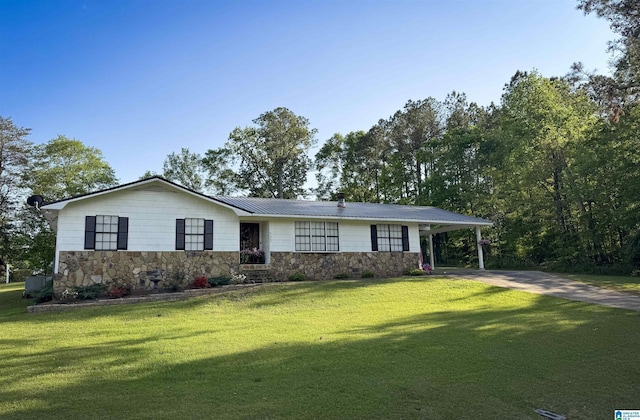 632 Bernard Couch Dr, Anniston, AL 36207 - ranch-style home featuring a carport, concrete driveway, a front lawn, and stone siding