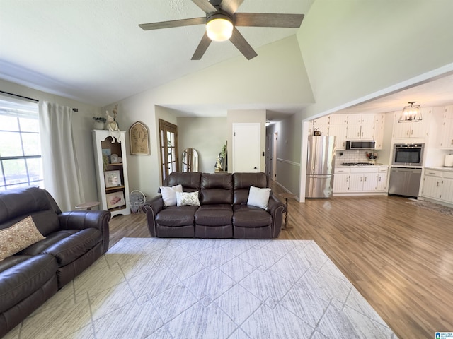 632 Bernard Couch Dr, Anniston, AL 36207 - living area featuring ceiling fan, high vaulted ceiling, and wood finished floors