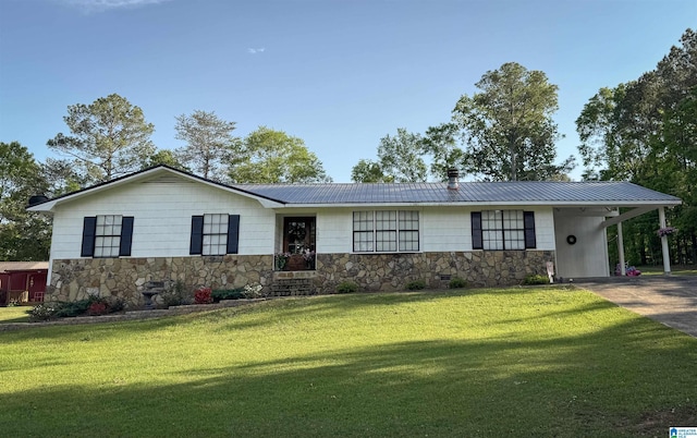 632 Bernard Couch Dr, Anniston, AL 36207 - single story home with a front lawn, metal roof, a carport, driveway, and stone siding
