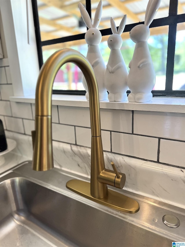 632 Bernard Couch Dr, Anniston, AL 36207 - details featuring decorative backsplash and a sink