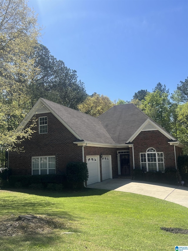 43 Dogwood Dr, Calera, AL 35040 - view of front facade with brick siding, driveway, a front yard, and a garage