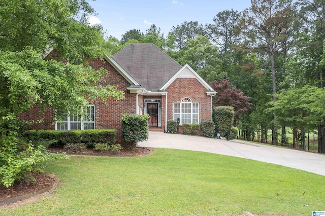 43 Dogwood Dr, Calera, AL 35040 - view of front facade with brick siding, a front lawn, and concrete driveway