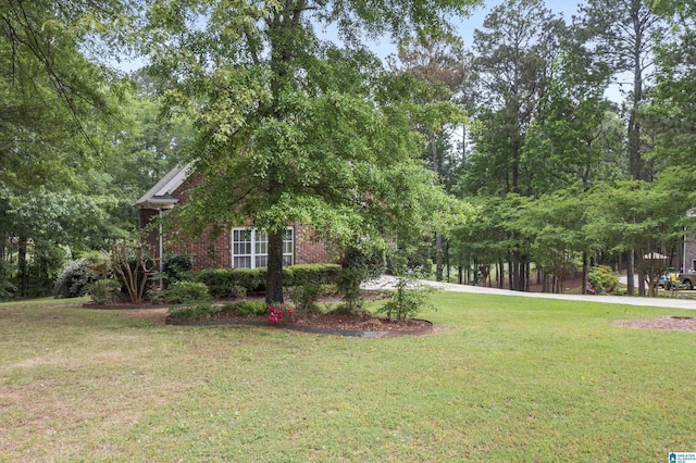 43 Dogwood Dr, Calera, AL 35040 - view of home's exterior featuring a lawn and brick siding