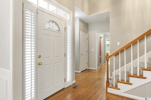 43 Dogwood Dr, Calera, AL 35040 - foyer with visible vents, wood finished floors, baseboards, a high ceiling, and stairs