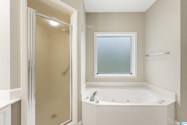 43 Dogwood Dr, Calera, AL 35040 - bathroom featuring vanity, a tub with jets, and a stall shower