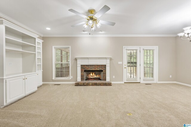43 Dogwood Dr, Calera, AL 35040 - unfurnished living room featuring baseboards, ornamental molding, a brick fireplace, and a wealth of natural light