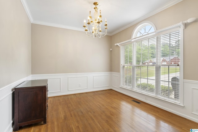 43 Dogwood Dr, Calera, AL 35040 - unfurnished room with visible vents, wainscoting, wood finished floors, and a chandelier