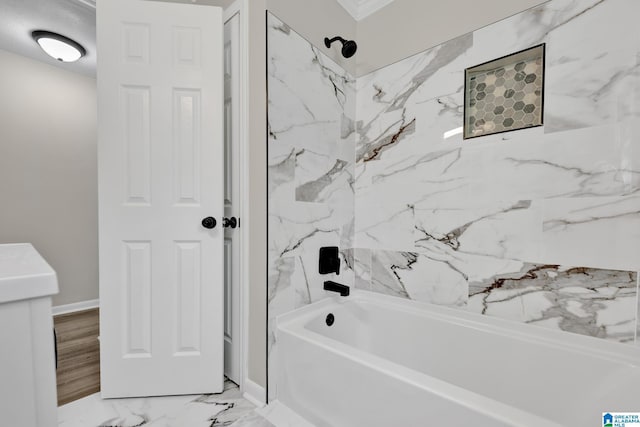 full bathroom with marble finish floor, baseboards, and shower / bathing tub combination
