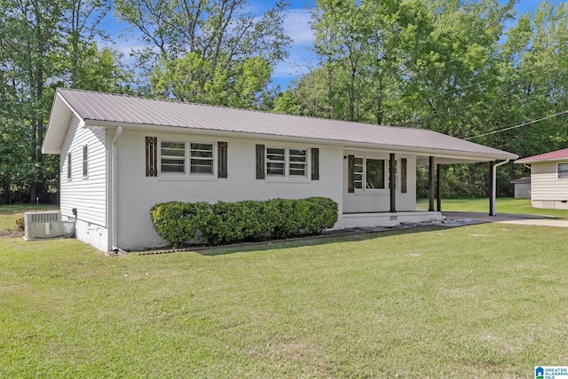 single story home with a front lawn, brick siding, central air condition unit, and metal roof