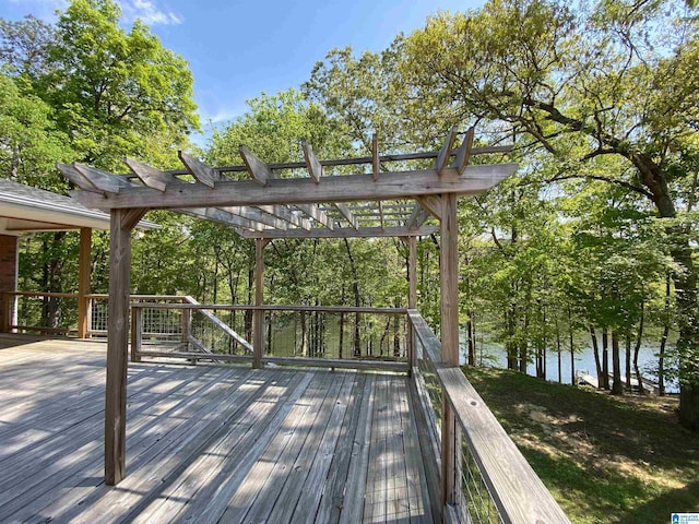 wooden terrace with a pergola and a water view