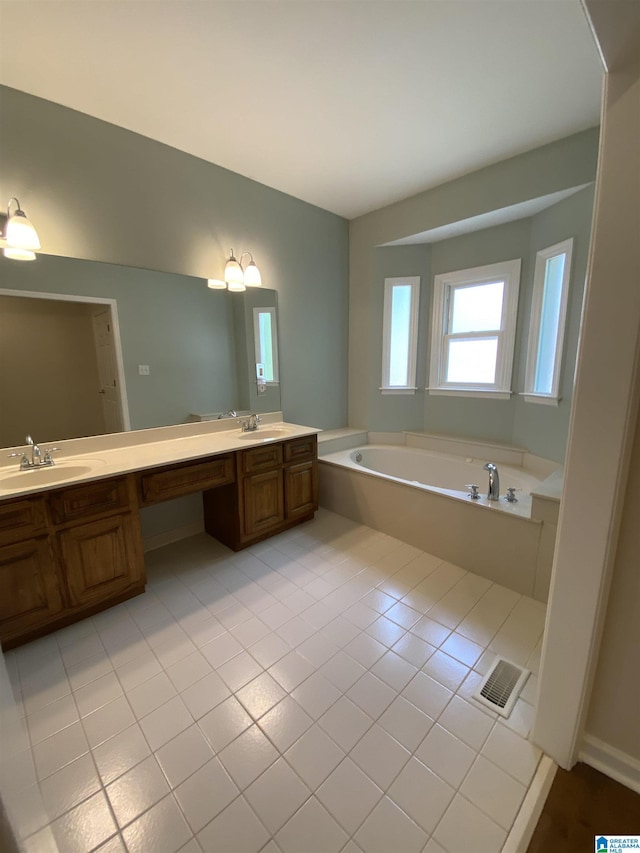 full bath featuring a sink, a bath, double vanity, tile patterned flooring, and visible vents