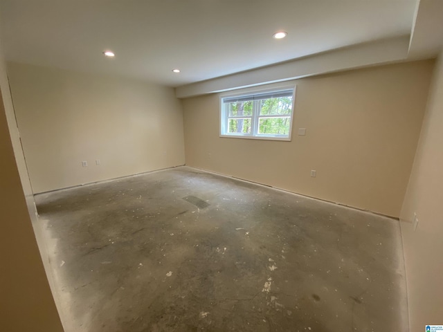 unfurnished room featuring concrete flooring and recessed lighting
