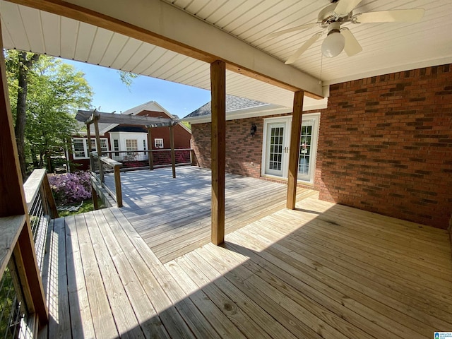 wooden terrace featuring ceiling fan