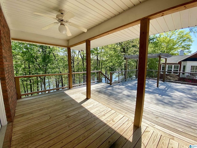 wooden terrace with a pergola and ceiling fan