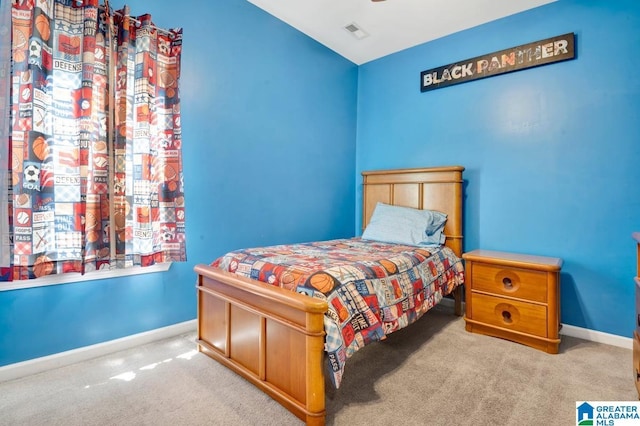 bedroom featuring baseboards, visible vents, and carpet flooring