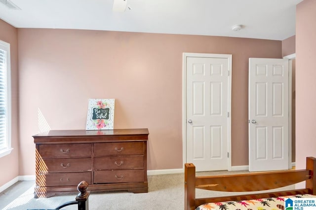 bedroom featuring visible vents, carpet flooring, and baseboards