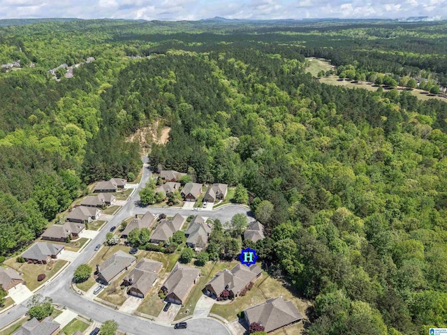 aerial view with a residential view and a wooded view