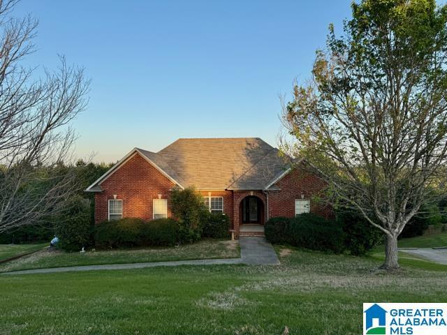 487 Woodland Ridge Rd, Odenville, AL 35120 - single story home with brick siding and a front lawn