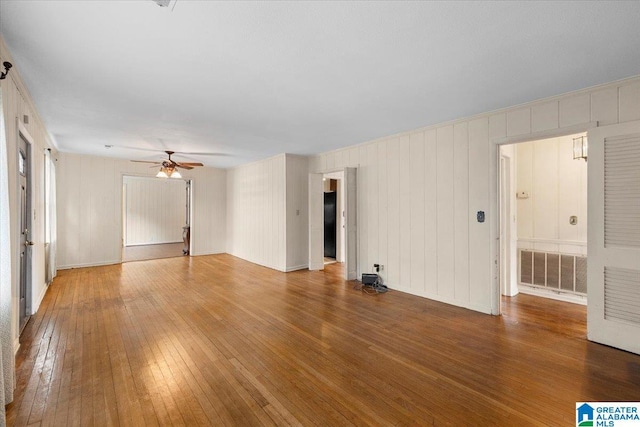 1203 Park Ave, Oneonta, AL 35121 - interior space featuring visible vents, baseboards, ceiling fan, and hardwood / wood-style floors
