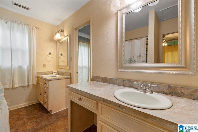1203 Park Ave, Oneonta, AL 35121 - bathroom with a sink, a textured wall, two vanities, and visible vents