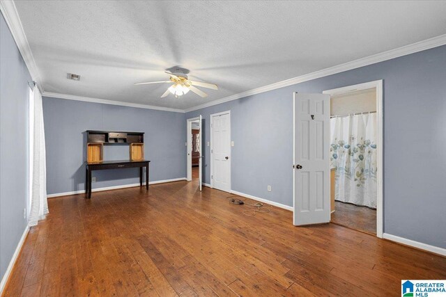 1203 Park Ave, Oneonta, AL 35121 - spare room featuring baseboards, ornamental molding, wood-type flooring, and a ceiling fan