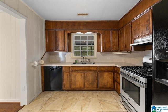 1203 Park Ave, Oneonta, AL 35121 - kitchen featuring visible vents, a sink, light countertops, black appliances, and under cabinet range hood