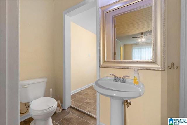 1203 Park Ave, Oneonta, AL 35121 - half bath with toilet, tile patterned floors, and baseboards