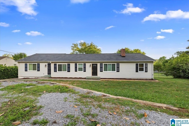 1203 Park Ave, Oneonta, AL 35121 - ranch-style house with a front lawn and a chimney