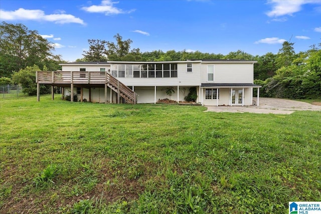 1203 Park Ave, Oneonta, AL 35121 - rear view of house with a wooden deck, fence, french doors, stairs, and a yard