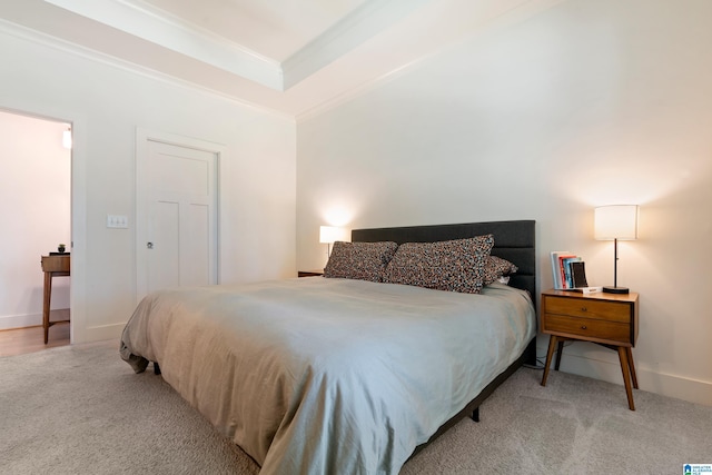 carpeted bedroom with ornamental molding
