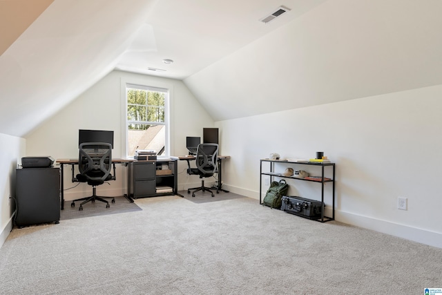 office with lofted ceiling, carpet flooring, visible vents, and baseboards