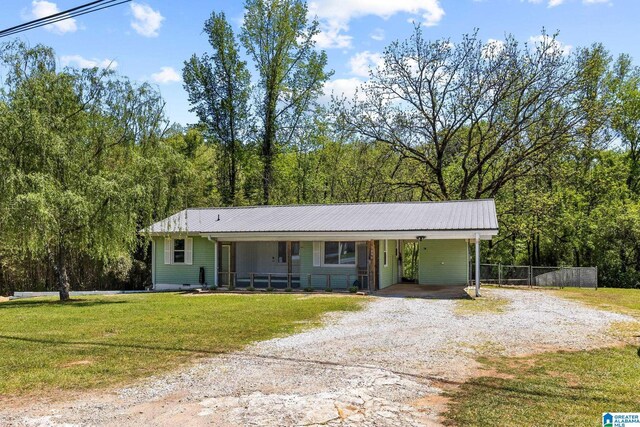 7096 US Highway 231, Cropwell, AL 35054 - ranch-style home featuring driveway, a front lawn, metal roof, and an attached carport